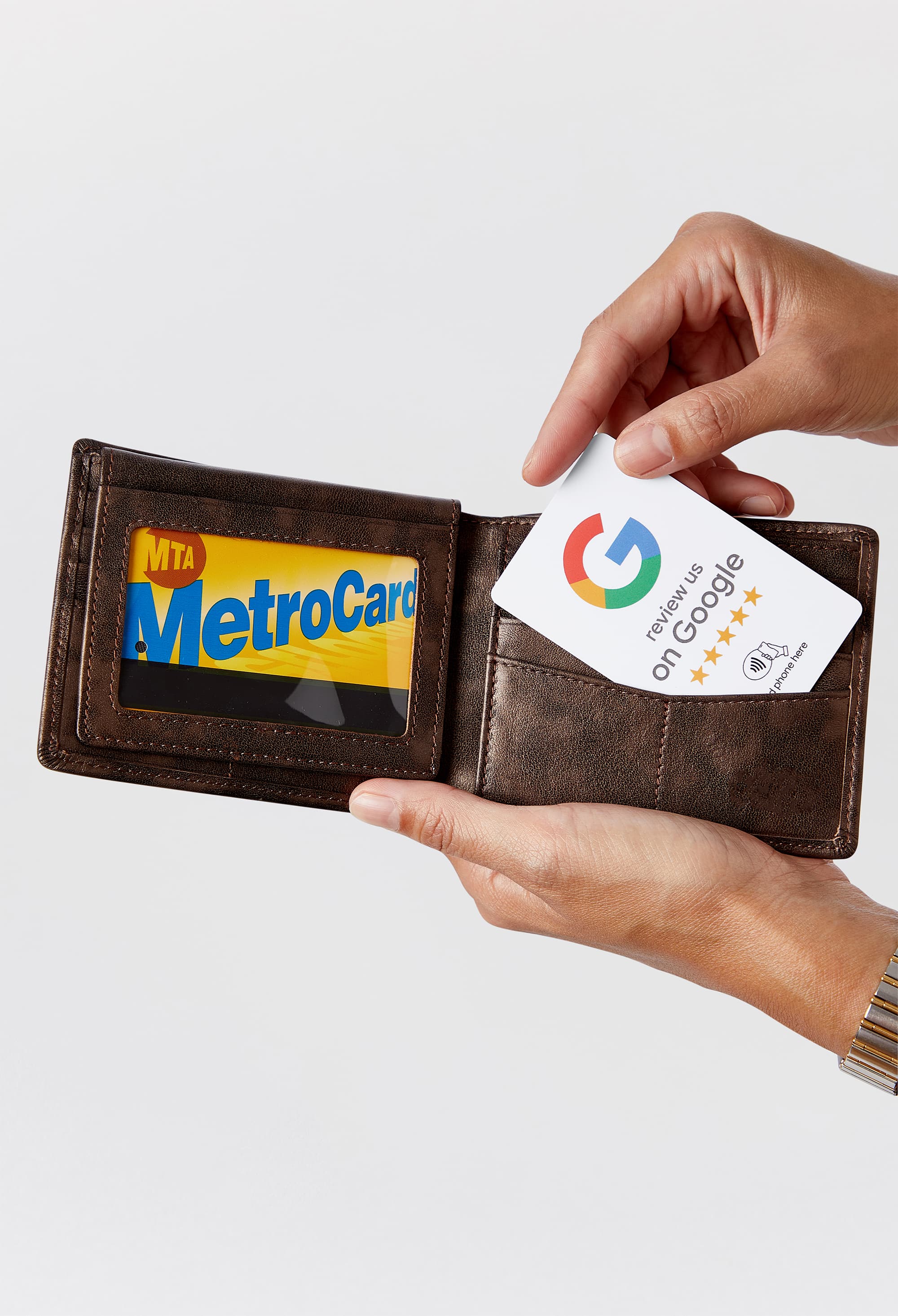 Wallet-sized Google Review tap card held in hand